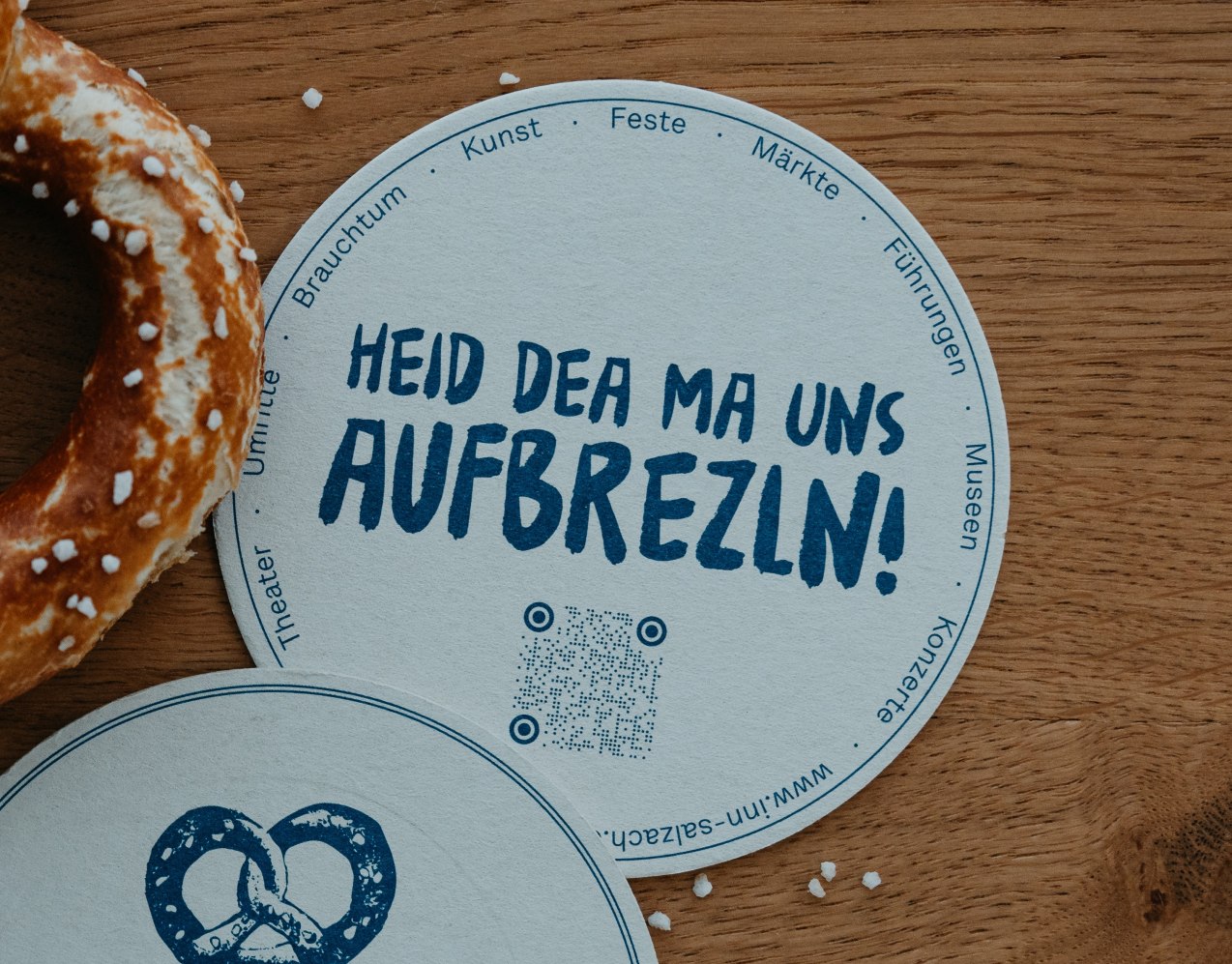 Bierdeckel mit bayerischem Spruch HEID DEA MA UNS AUFBREZLN, &copy; Inn-Salzach Tourismus