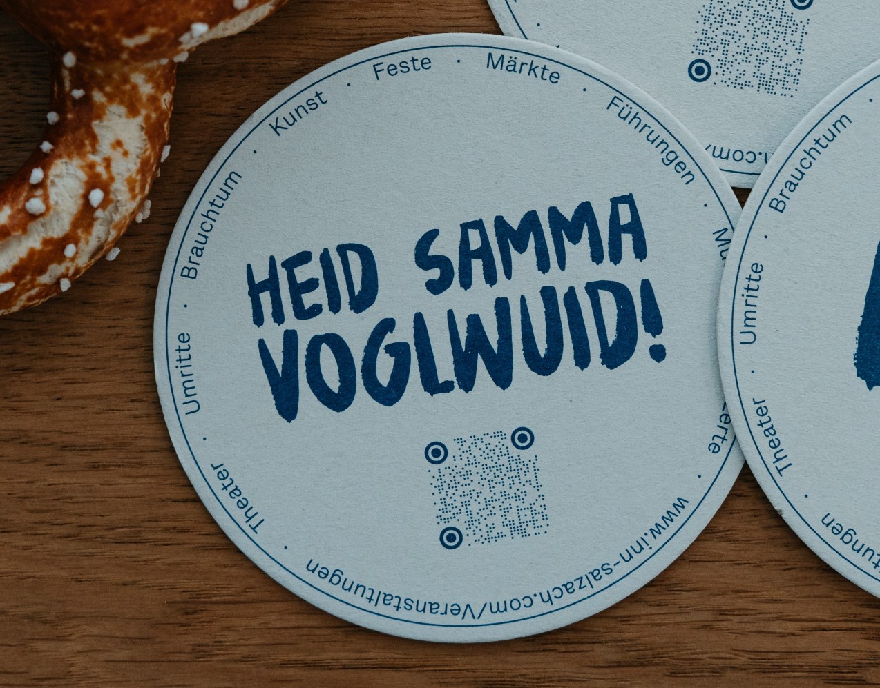 Bierdeckel mit bayerischem Spruch HEID SAMMA VOGLWUID, &copy; Inn-Salzach Tourismus